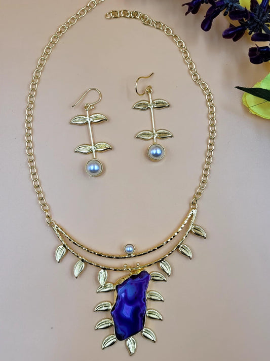 Leaf Designed Hasli Style Handmade Golden Brass Necklace Set With Raw Purple Stone