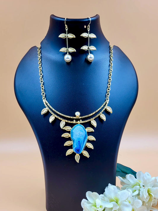 Leaf Designed Hasli Style Handmade Golden Brass Necklace Set with Raw Blue Stone